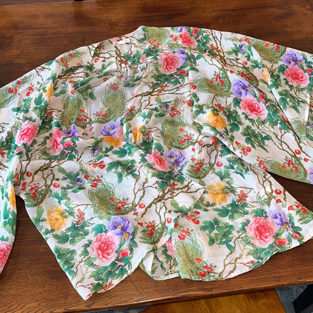 Sheer floral draping wrap with flowing sleeves